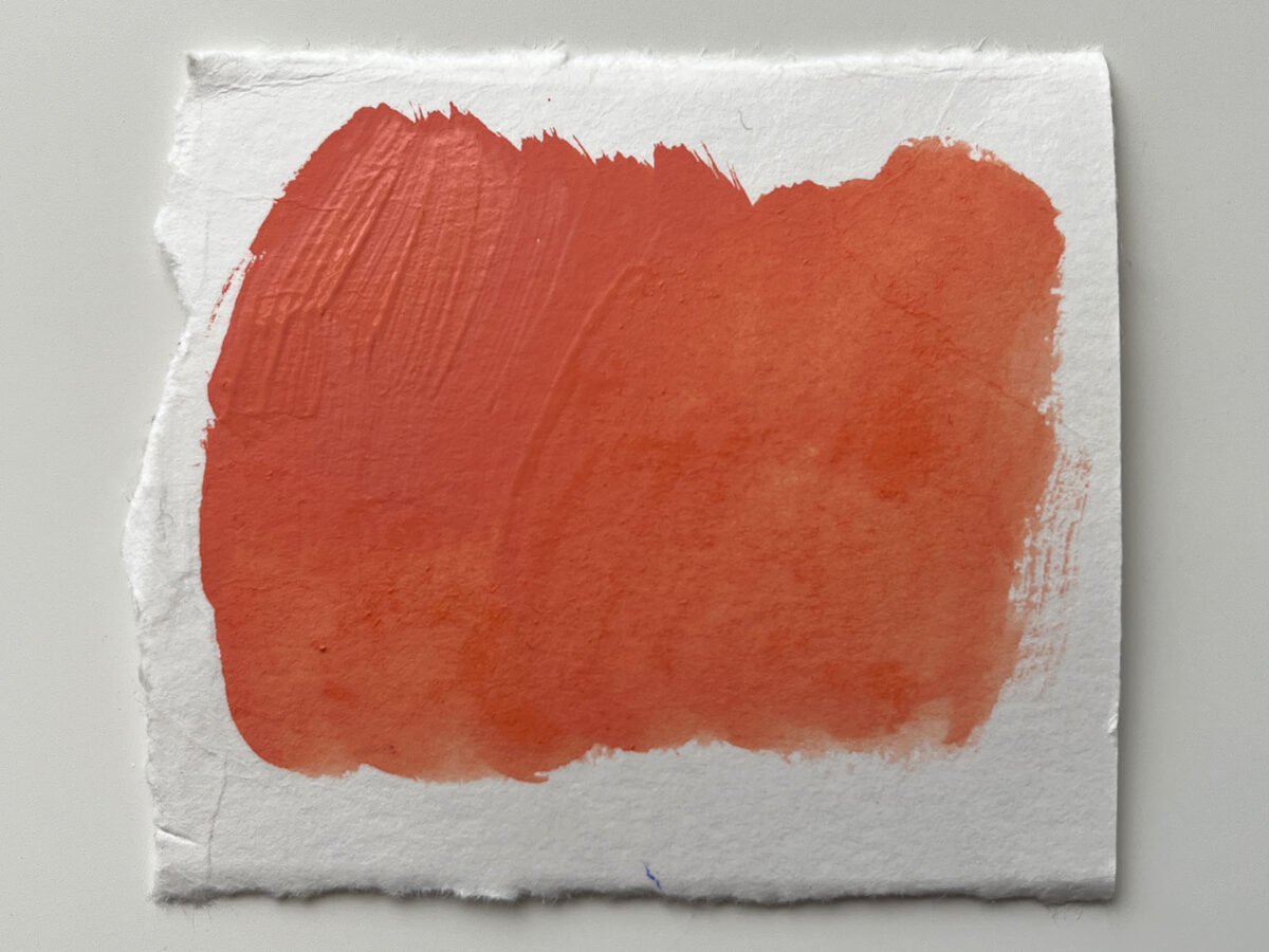 The coral red acrylic gouache when wet