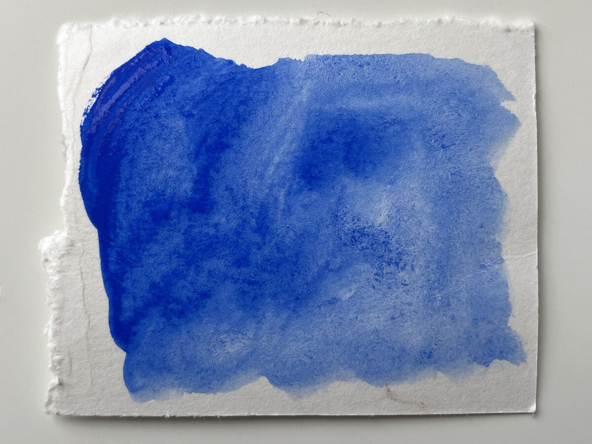 The ultramarine blue acrylic gouache when wet
